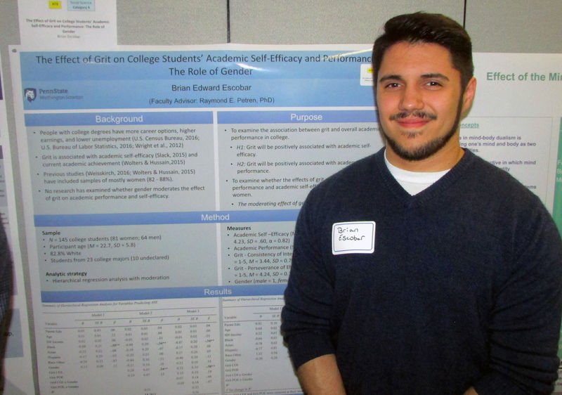 student research presenter Student researcher Brian Escobar with his project at the Undergraduate Research Fair