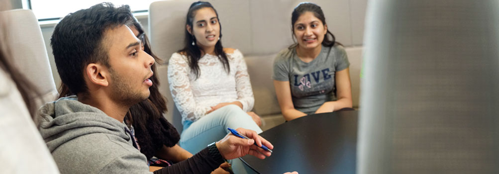 Diverse students meet to discuss diversity on campus.