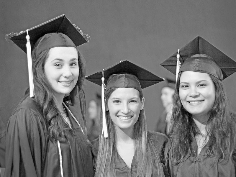 3 girls in cap and gown