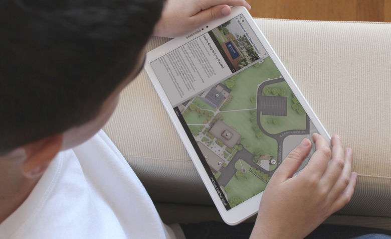 student looking at interactive map on a tablet