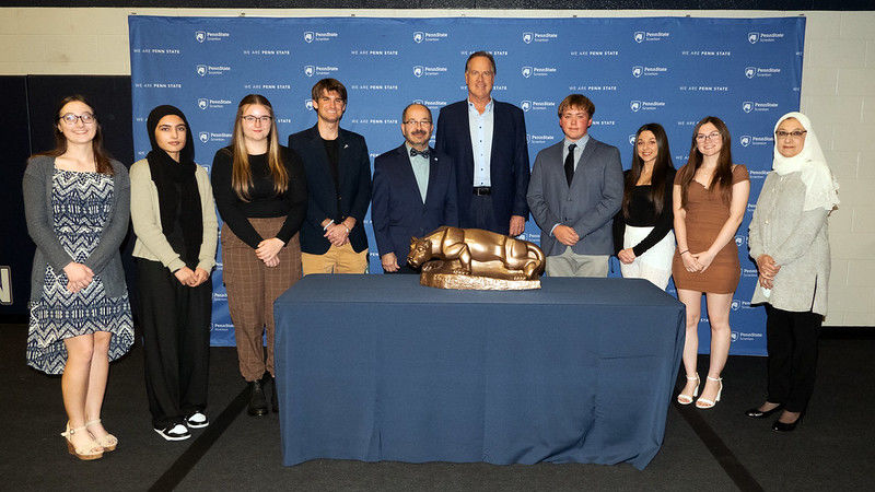 Chancellor Wafa and donor Tom Zenty pose with their scholarship recipients