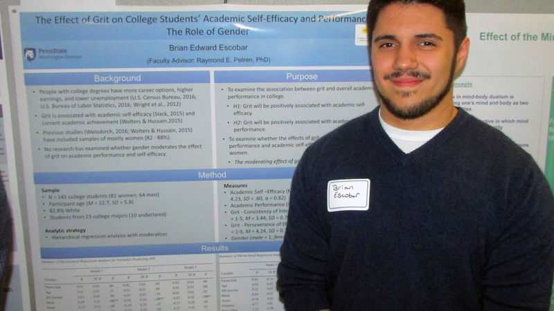 Student researcher Brian Escobar with his project at the Undergraduate Research Fair
