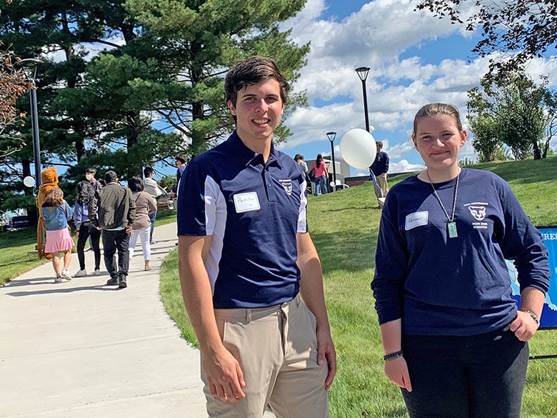 two students in penn state gear give a tour on penn state scranton campus