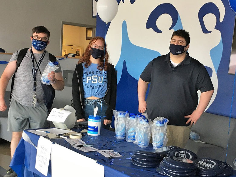 three students wearing protective mask
