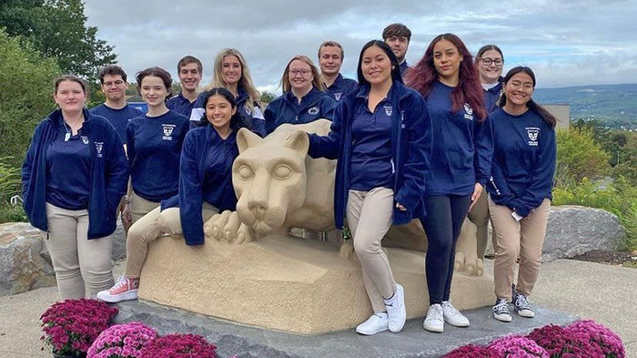 Lion Ambassadors group poses with Nittany Lion statue