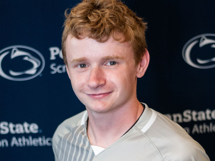 Conor Tone headshot with Penn State sports logo in background