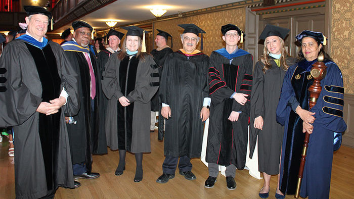 group of faculty in their regalia
