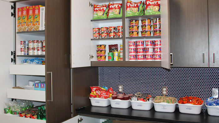 cupboards stocked with canned goods and snacks