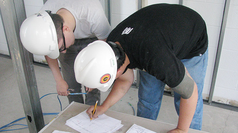 students reviewing wiring plans