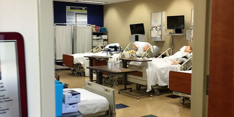 mock hospital room with 3 hospital beds and simulated patients