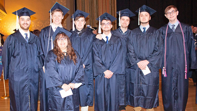 group of 8 graduates