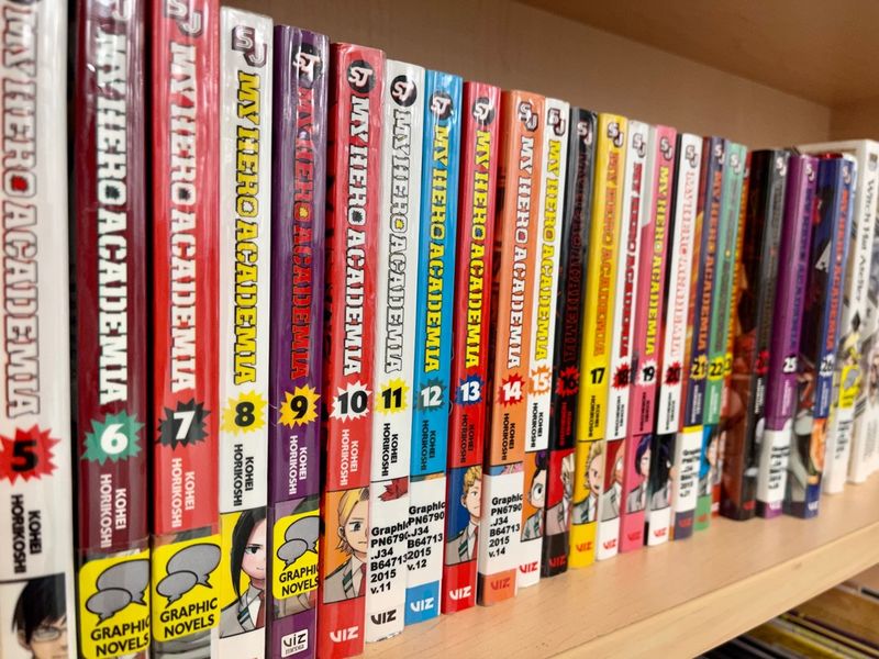 A shelf containing the popular Japanese series of books, My Hero Academia