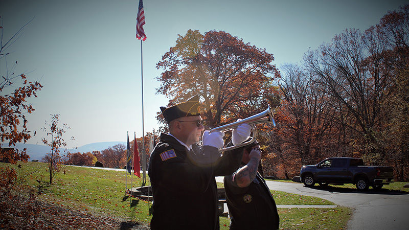 Jayson plays taps at a local military ceremony