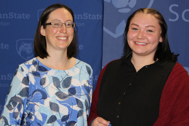 Kayla Kozlowski receives her award from Meg Van Etten