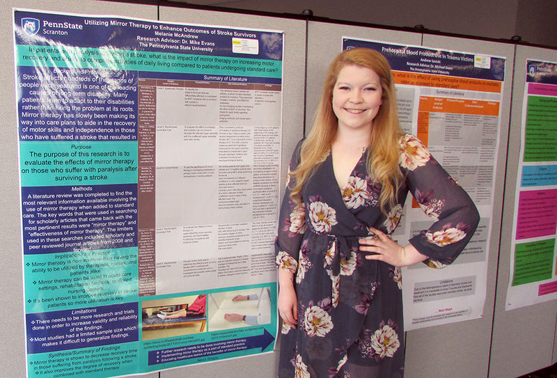 Melanie McAndrew and her poster