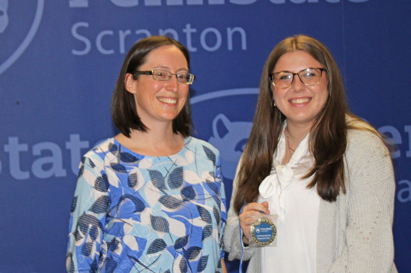 Fair coordinator Meg Van Etten presents Sarah Sherpinskas her first place award