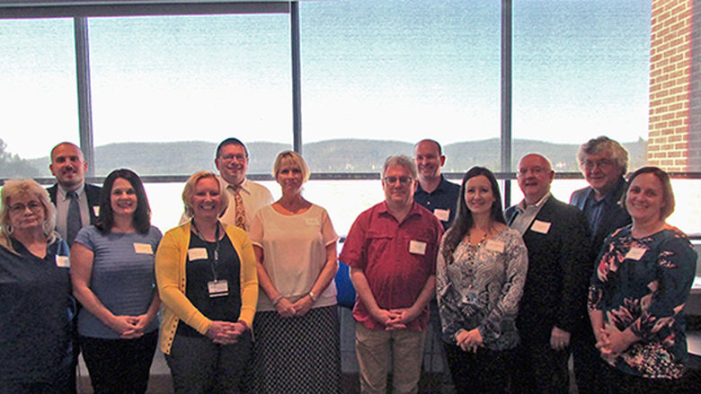 group of adjunct faculty members posing for a formal photo
