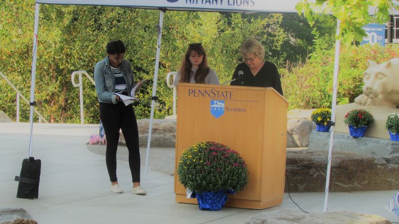 Deb Johnson reading at the podium