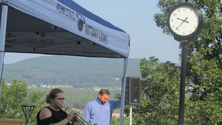 Kelly Morris plays taps