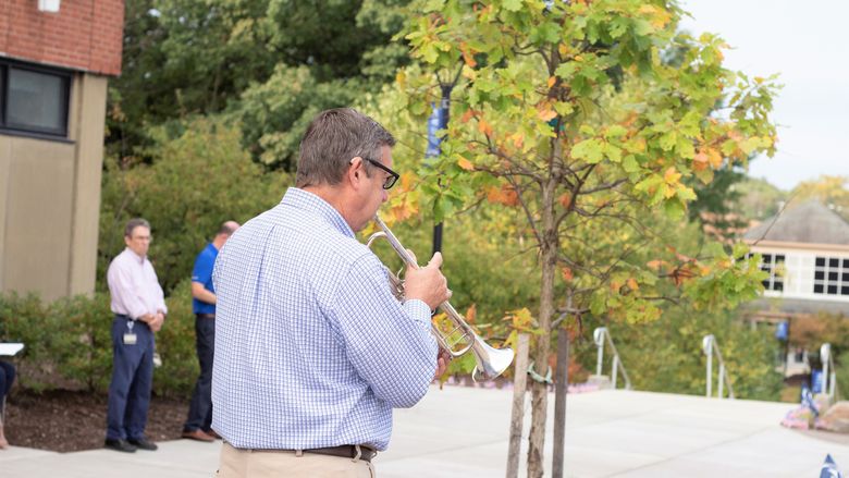 Todd Adams playing taps
