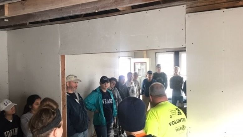 students arrive at the service project site