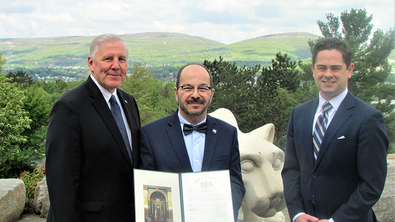 Blake presenting citation to Dr. Wafa