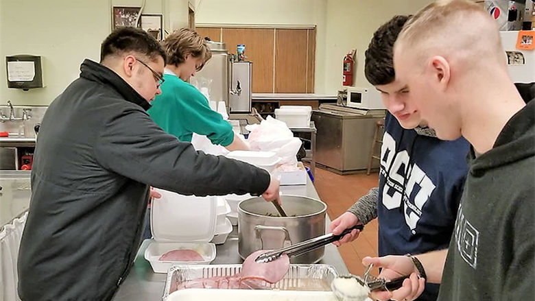 IST members serve food for One Hot Meal program