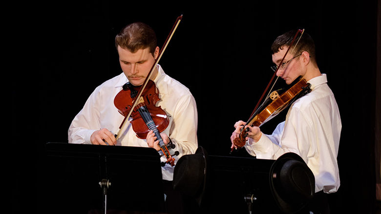 Two students play violin