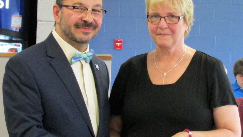 Mary Runco receives Excellence Award from Dr. Marwan Wafa at PSWS