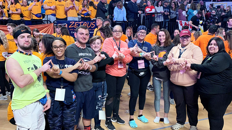 Scranton dancers pose for a photo with crowd in background