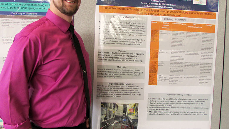 nursing student shows his research poster