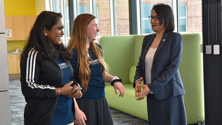 Two Lion Ambassadors speaking to Bendapudi