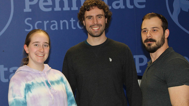 Alexandra Trinovitch, Timothy Nelson and Michael Border receive their award