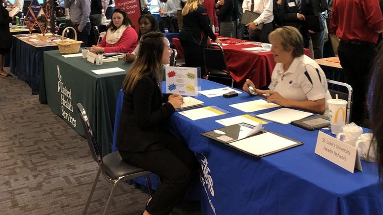 students at employer tables.
