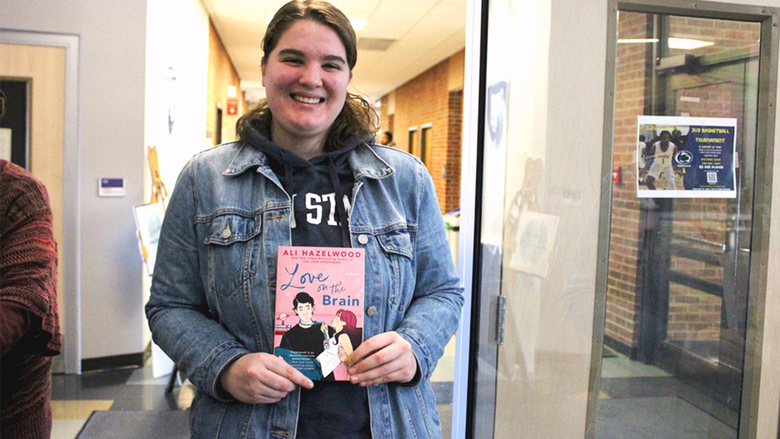 Student Chloe Tucker poses with her book selection