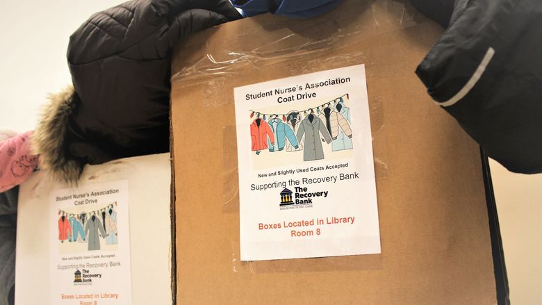 two boxes filled with coats have been collected for the SNA's coat drive