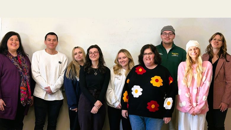 Professor Longo poses with her students and recent guest speaker