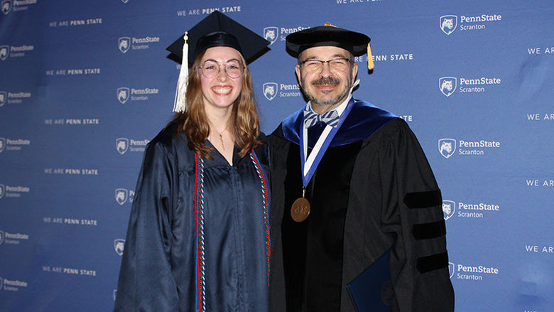woman and man in graduation attire