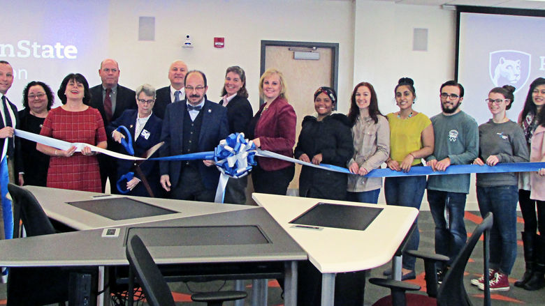 campus officials cutting the ribbon in the new IST lab