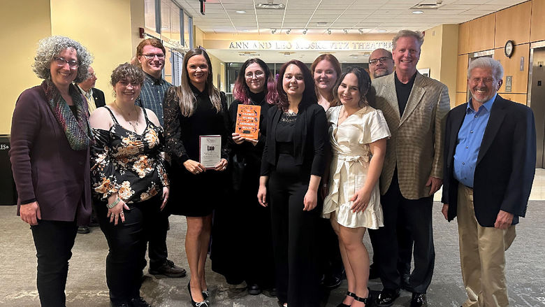 Scranton students and faculty members pose for a group photo with the author