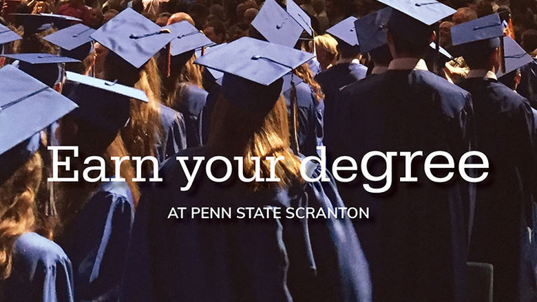 graduates in cap and gown.  