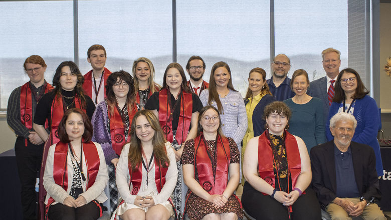 group of honor society inductees pose for a group photo