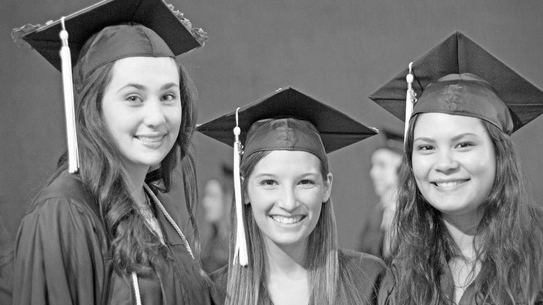 3 girls in cap and gown