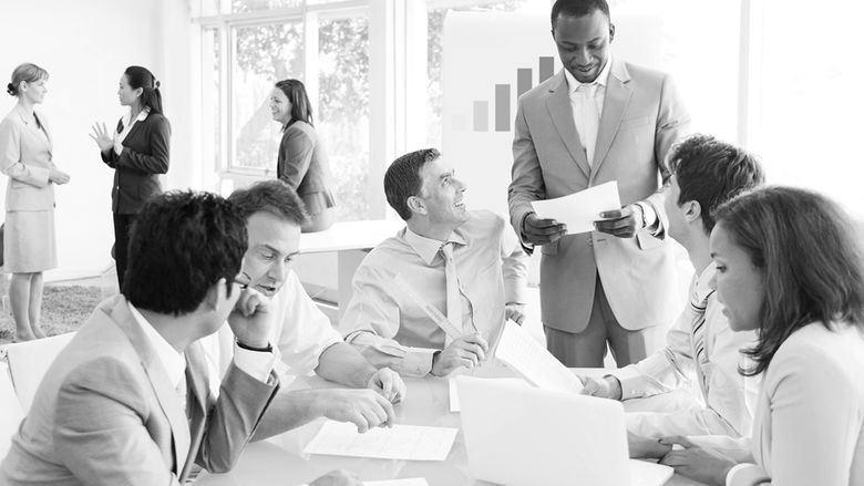 group of professionals having a meeting around a table