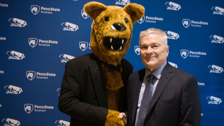 Dr. Eric Barron with the Nittany Lion
