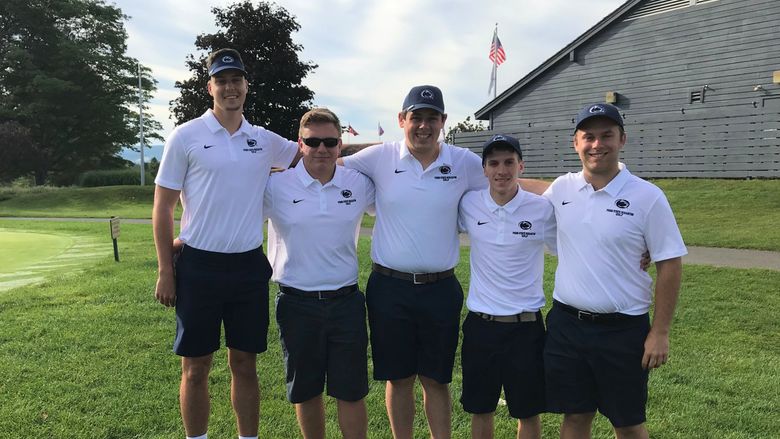 Golf team members pose for a photo