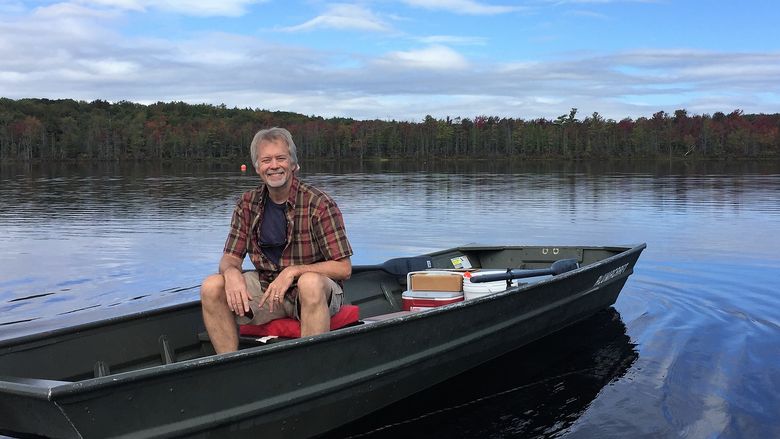 Dr. Dale Holen in boat at state park