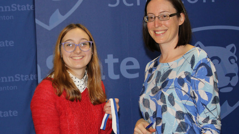Olivia Maikranz receives her first place award