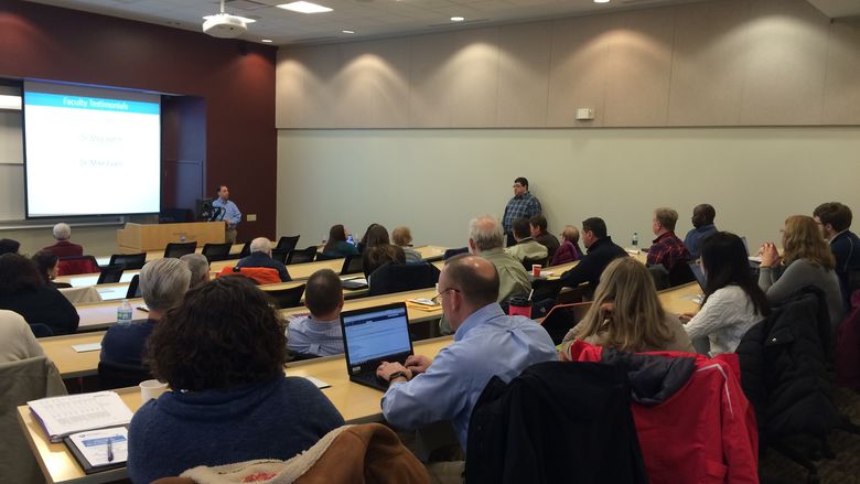 Faculty presenting slides at development event