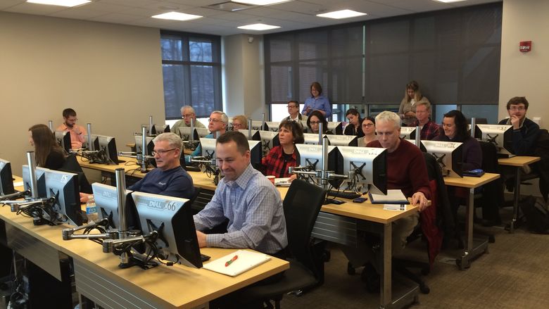 Faculty working in computer lab